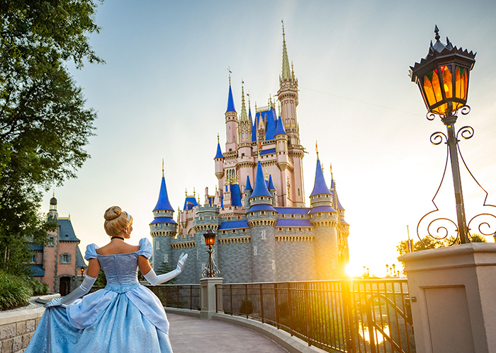 The Cinderella Castle located in Fantasyland at Magic Kingdom Park in Walt Disney World. Cinderella is admiring the castle from an angle.