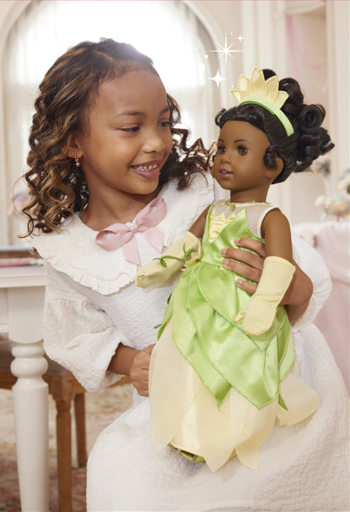 Girl with American Girl(R) Tiana doll