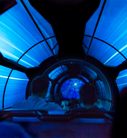 Guests on Hyperspace Mountain ride