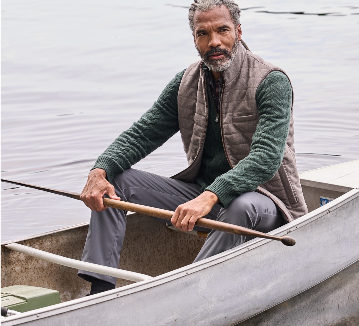 man in green sweater on a boat