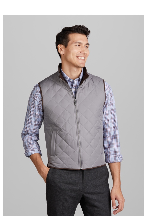 man in gray vest