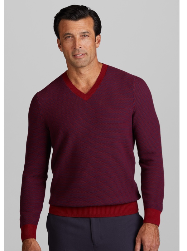 man in burgundy sweater