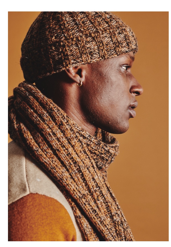 Man wearing tan beanie and scarf