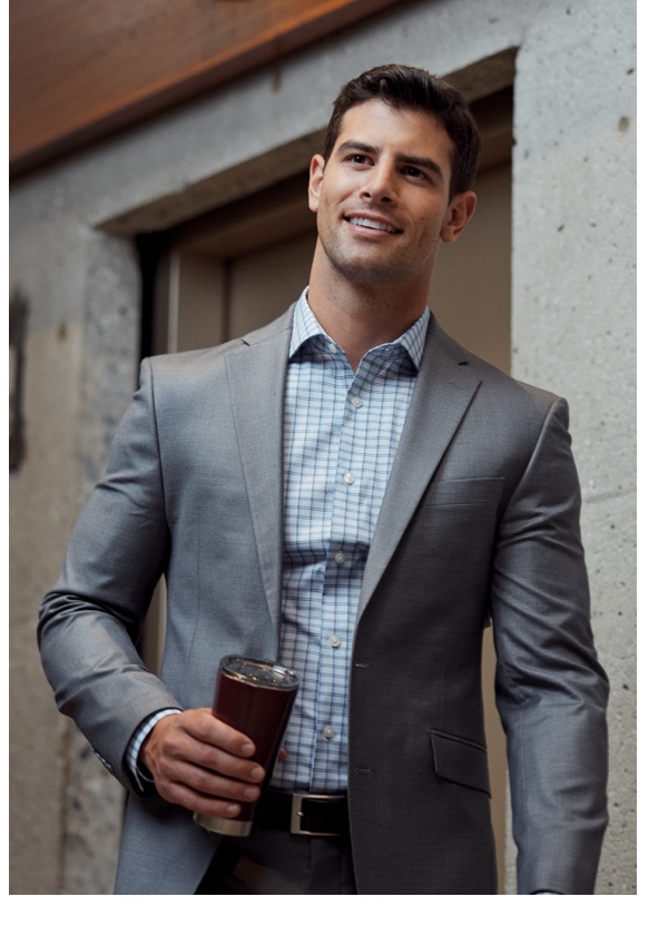 Man in gray suit and blue dress shirt